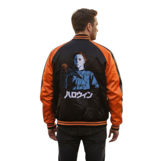 Person wearing a black and orange jacket with a graphic design on the back