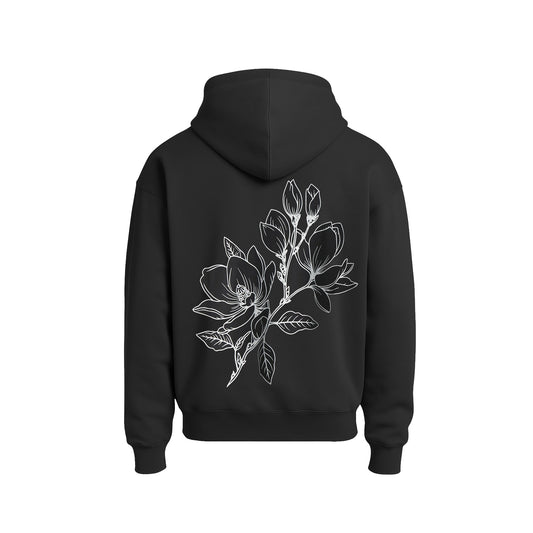 Black hoodie with a white floral design on the back against a white background