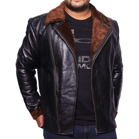 A man wearing a vintage black leather biker jacket with quilted panels and a heavy-duty front zipper.
