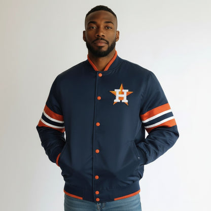 Man wearing a navy blue jacket with orange and white accents and a logo on a plain background