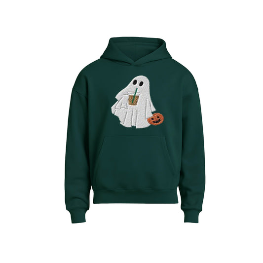 Green hoodie with a ghost design holding a pumpkin and drink on a white background