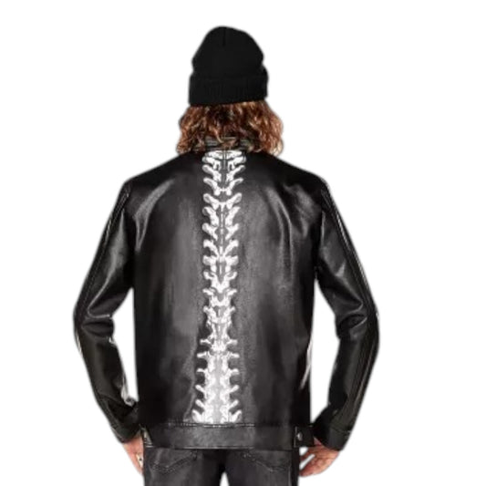 Black leather jacket with silver spine design on the back, worn by a person.