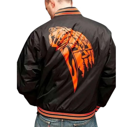 Black jacket with orange and red design on the back, worn by a person.