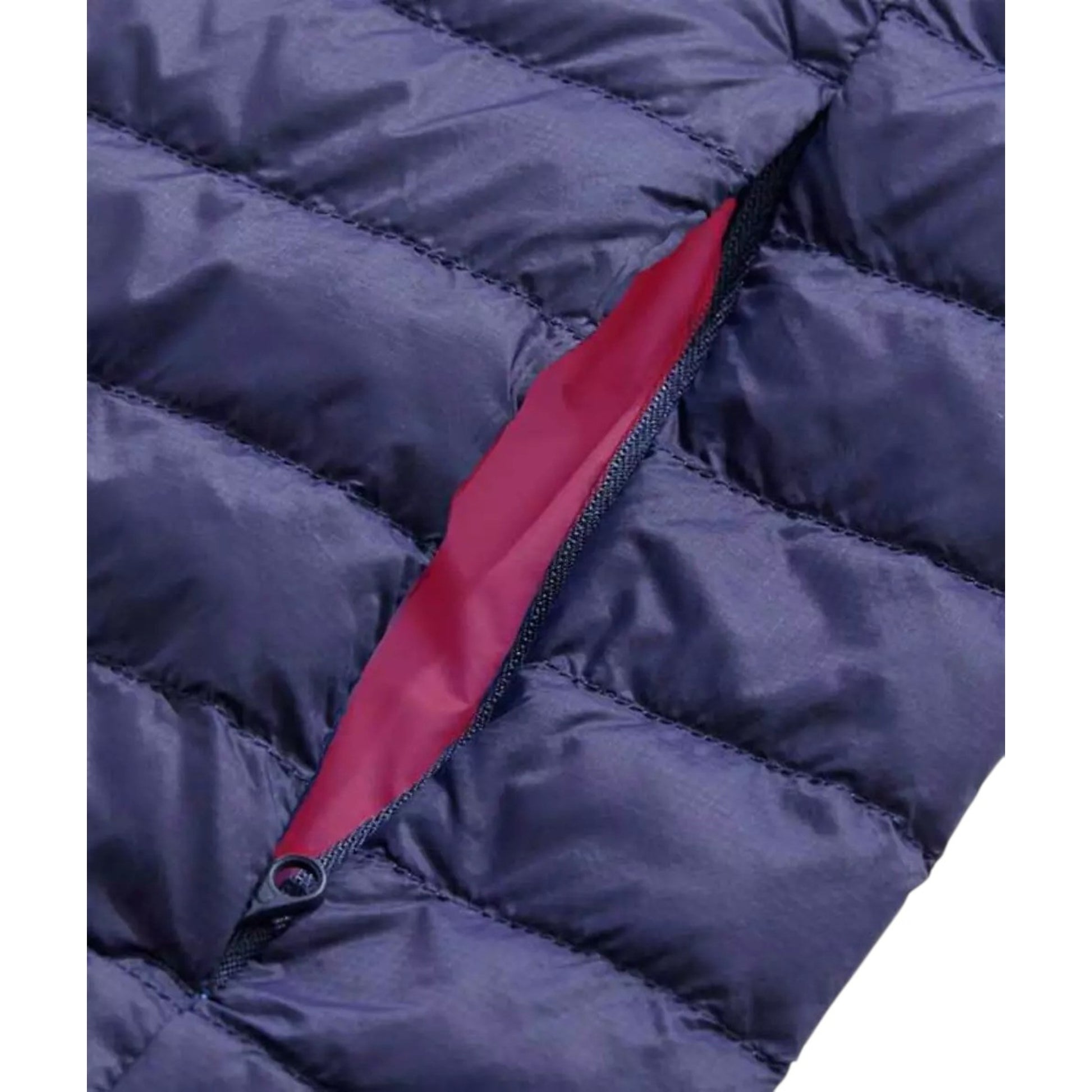 Close-up of a blue puffer jacket with a red interior lining.