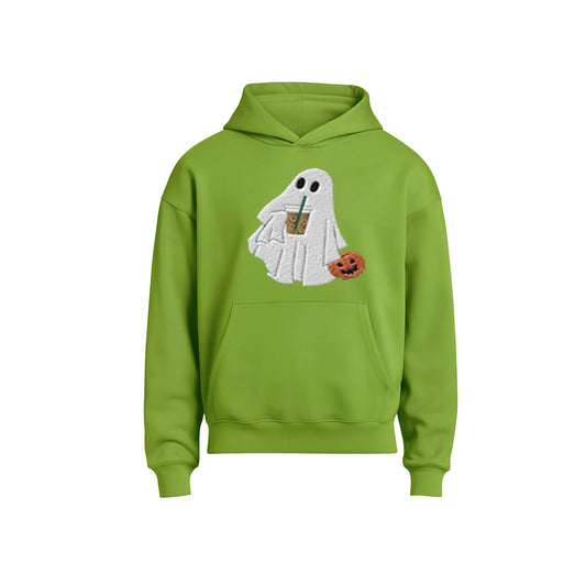 Green hoodie with ghost design holding a drink and pumpkin on a white background