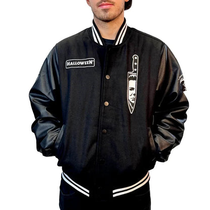 Black letterman jacket with 'Halloween' logo and knife design on a white background