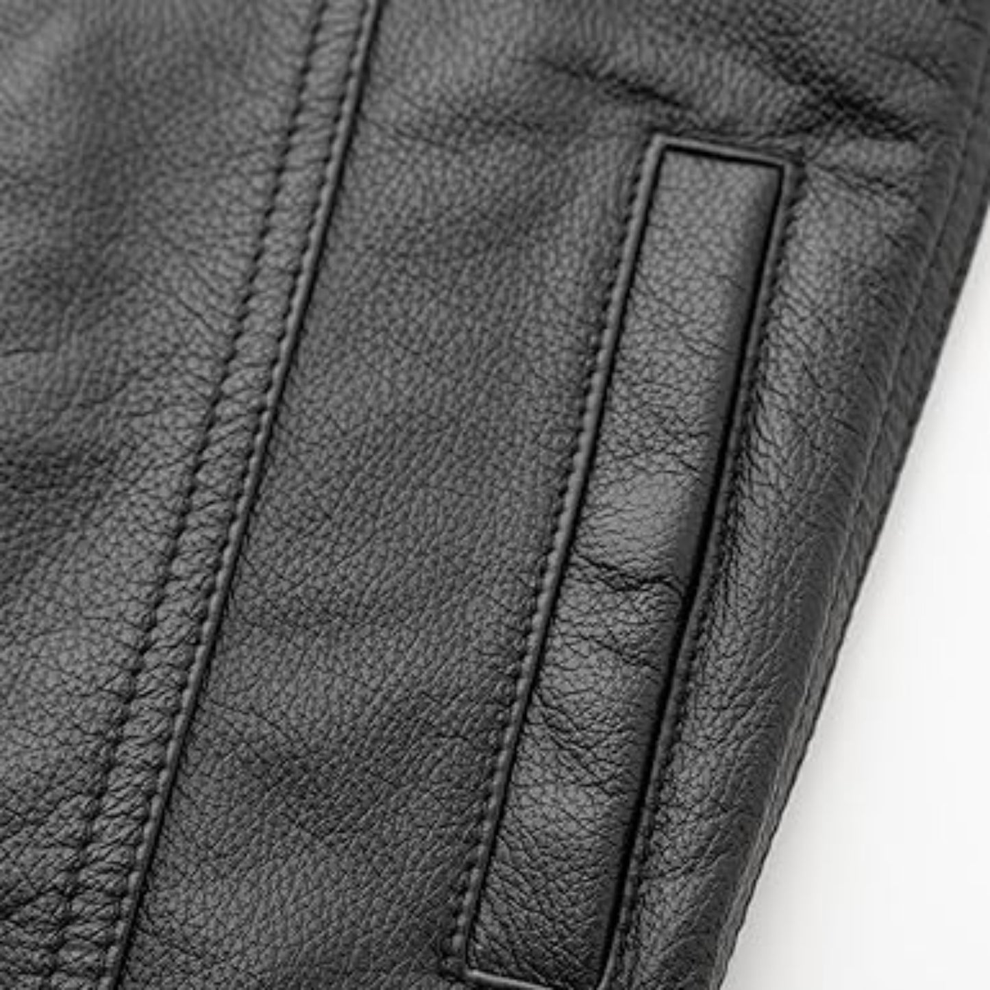 Close-up of black leather texture with stitching detail