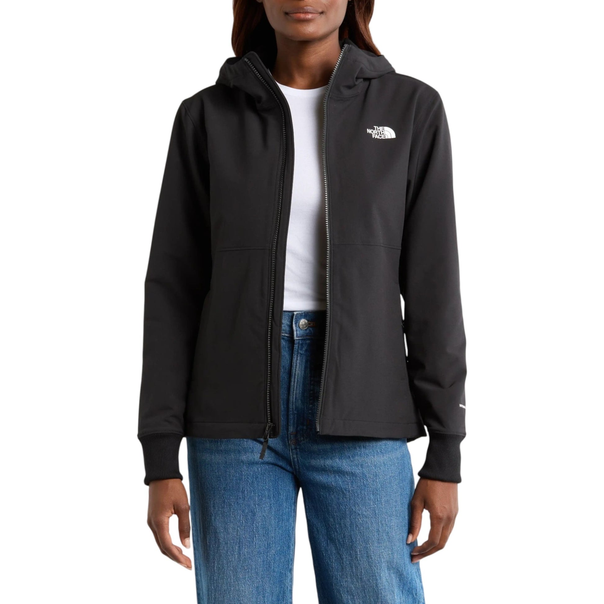 Person wearing a black jacket with a brand logo on a white background