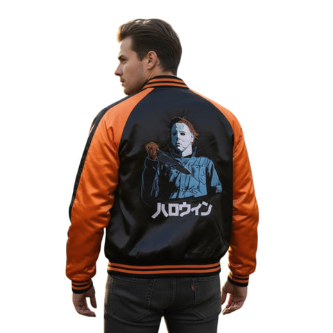 Person wearing a black and orange jacket with a graphic design on the back