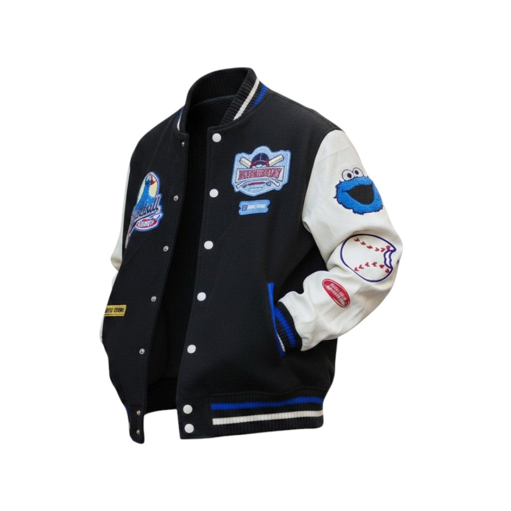 Black and white varsity jacket with patches on a white background