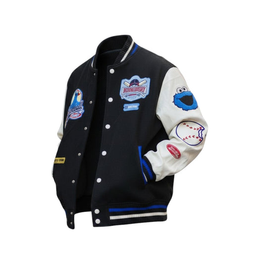 Black and white varsity jacket with patches on a white background