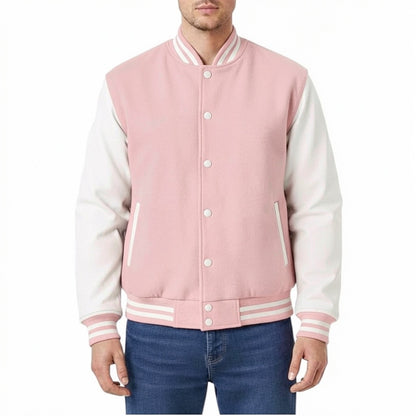 Pink and white varsity jacket worn by a person on a white background