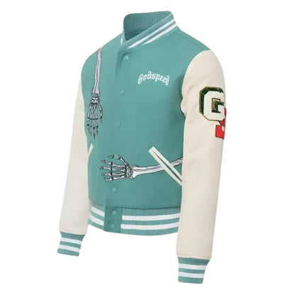 Teal and cream varsity jacket with skeleton design and brand logo on a white background