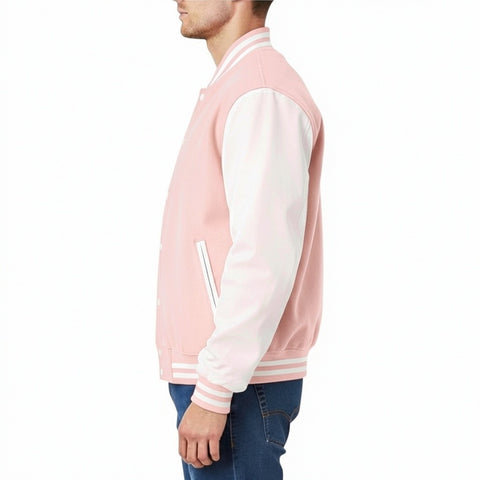 Person wearing a pink and white varsity jacket on a white background
