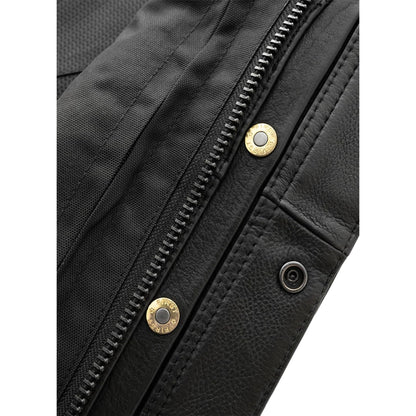 Close-up of a black leather jacket with gold zipper pulls and buttons.
