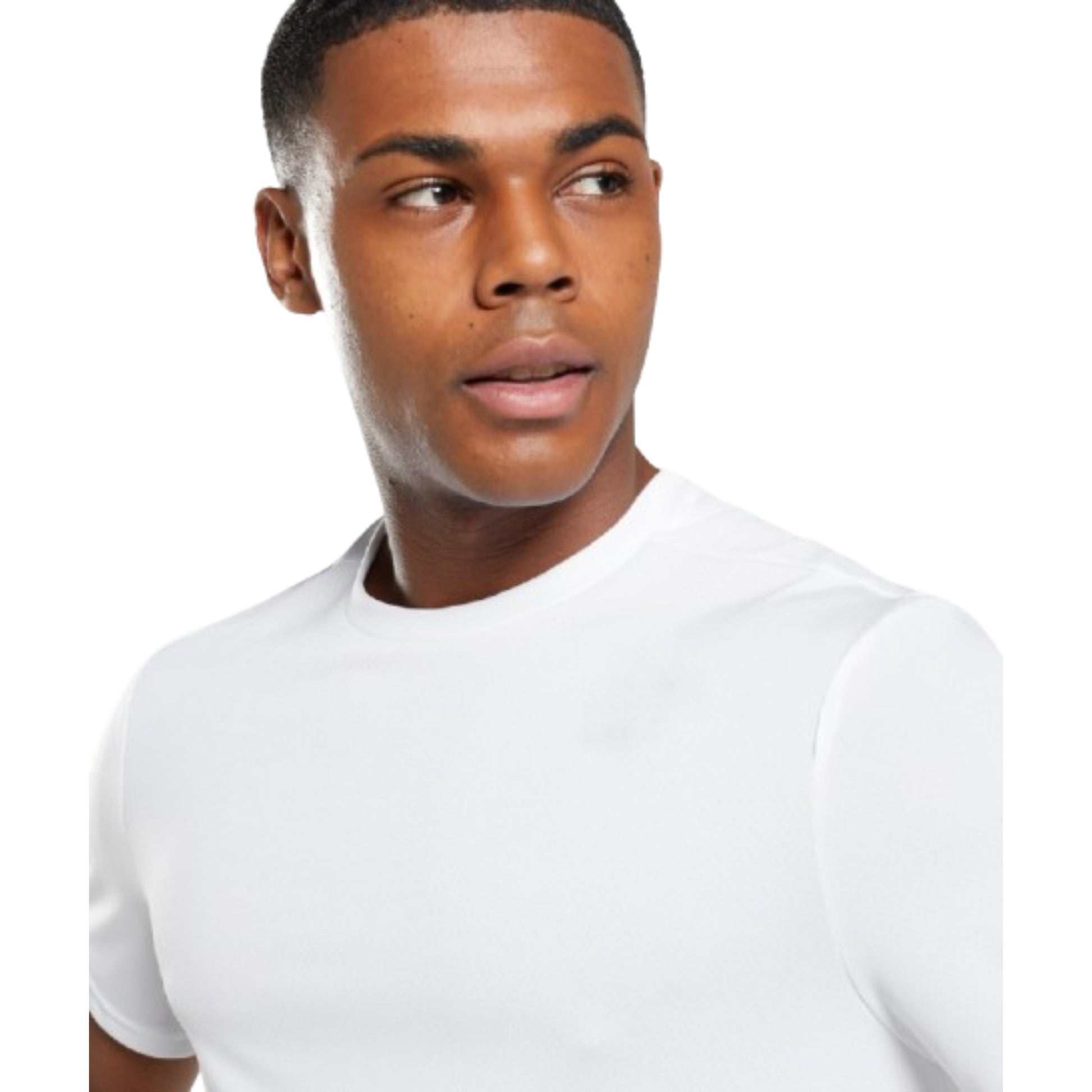Man wearing a plain white t-shirt against a white background