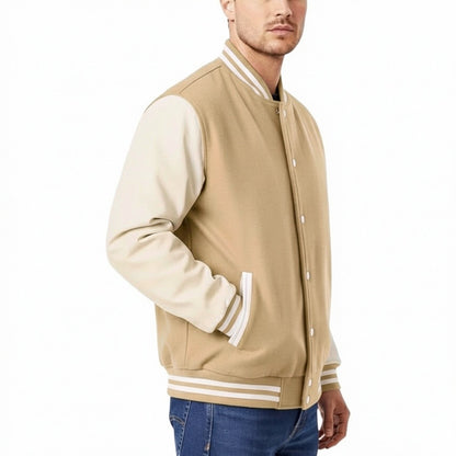 Beige varsity jacket with white accents worn by a person on a white background