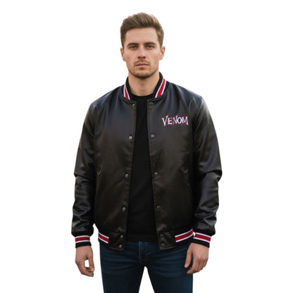Man wearing a black 'Venom' jacket on a white background