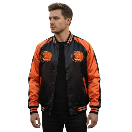 Man wearing a black and orange jacket with pumpkin designs on a white background