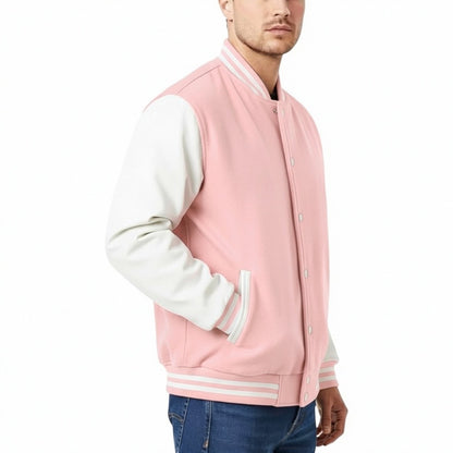 Pink and white varsity jacket worn by a person on a white background