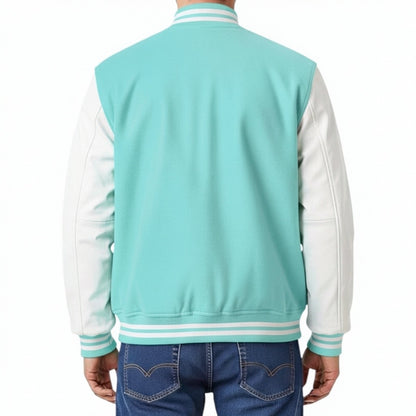 Turquoise and white varsity jacket worn by a person on a white background