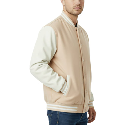 Man wearing a beige and white varsity jacket on a white background