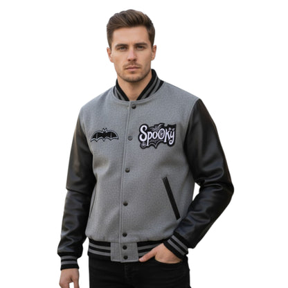 Man wearing a gray and black varsity jacket with 'Spooky' and bat logo on a white background