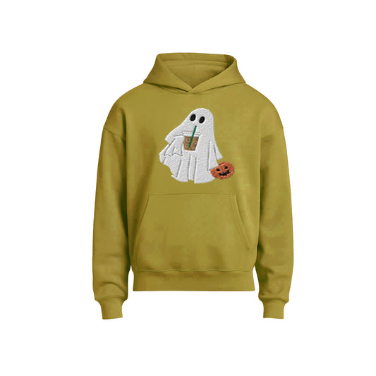 Green hoodie with ghost design holding a coffee cup and pumpkin on a white background