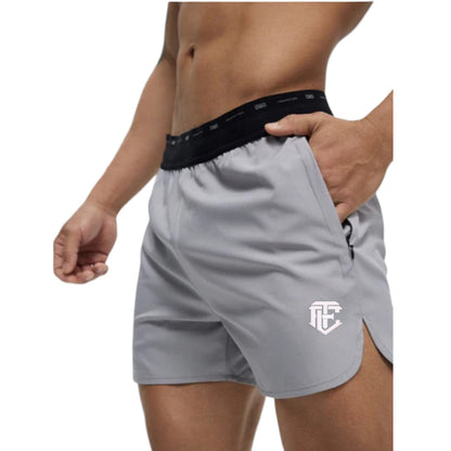 Gray athletic shorts with a logo on a white background