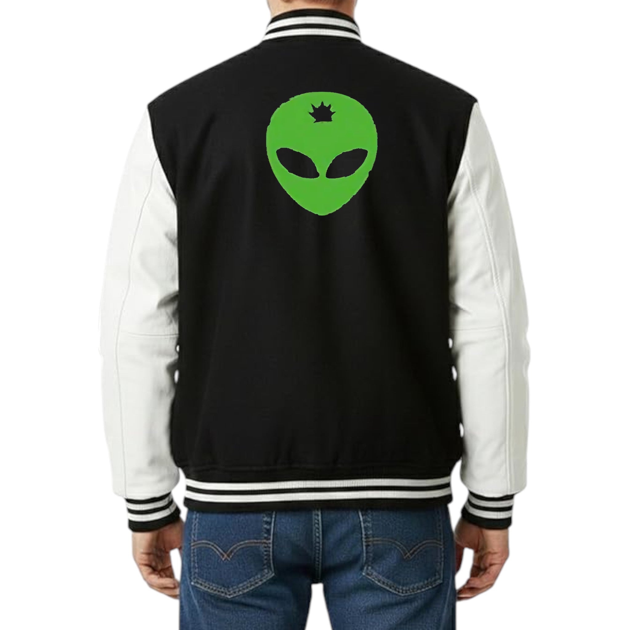 Black varsity jacket with a green alien symbol on the back, worn by a person.