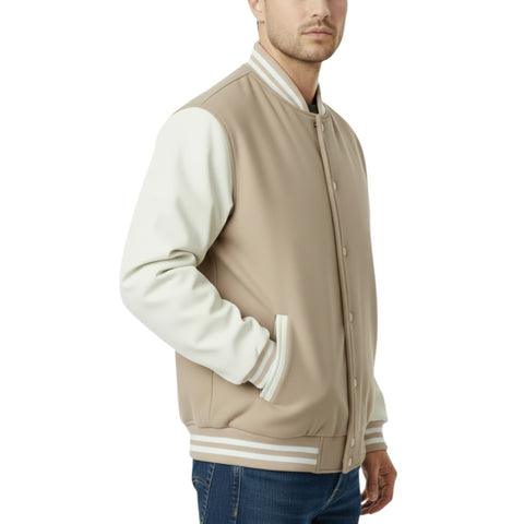 Man wearing a beige and white varsity jacket on a white background