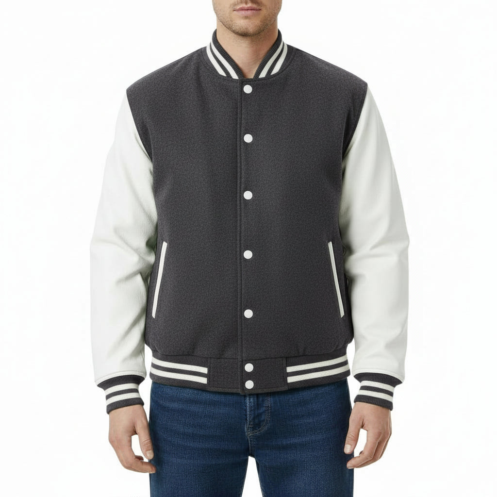 Person wearing a Dark Gray and white varsity jacket on a white background