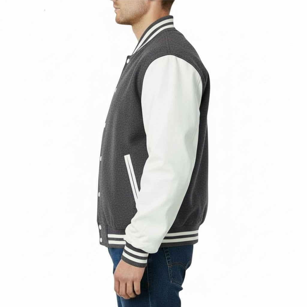 Person wearing a Dark Grey and white varsity jacket on a white background