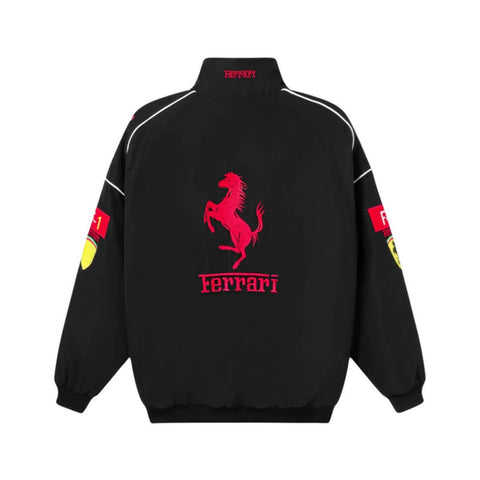 A black Ferrari jacket shown from the back, featuring a large red prancing horse logo and 'Ferrari' text in red on the center back, with white piping details and red/yellow logo patches on the sleeves.
