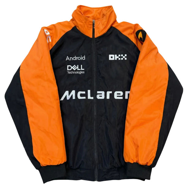 A McLaren racing team jacket with a black and bright orange color-blocked design, featuring sponsor logos including Dell, Android, and OXX on the chest.