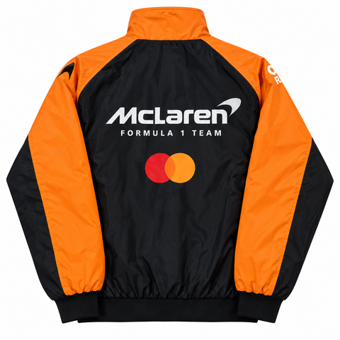 A McLaren Formula 1 Team windbreaker jacket shown from the back, featuring a black and bright orange color-blocked design with the team logo and Mastercard brand mark printed on the back.