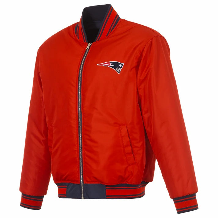 A red nylon bomber jacket with navy and red striped ribbed trim, featuring a zippered front and the New England Patriots logo on the left chest.