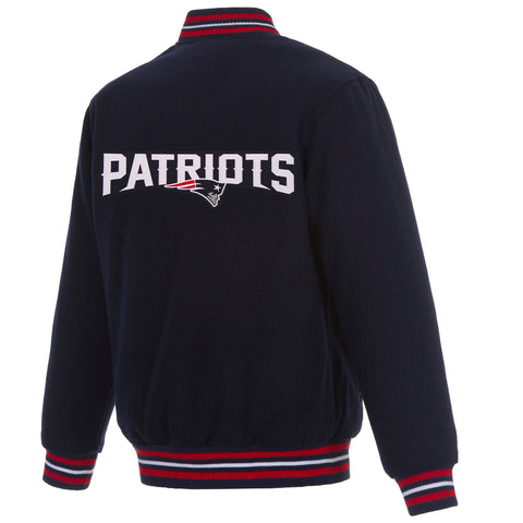 A navy blue fleece jacket shown from the back, featuring 'PATRIOTS' in white varsity lettering with the New England Patriots logo in red, white, and blue across the upper back. The jacket has striped ribbed cuffs and hem with red, white, and blue accents.