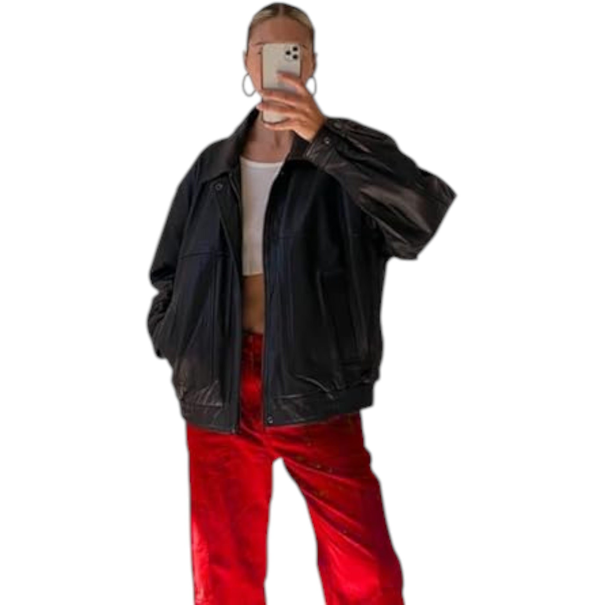 Person wearing a black jacket and red pants on a white background