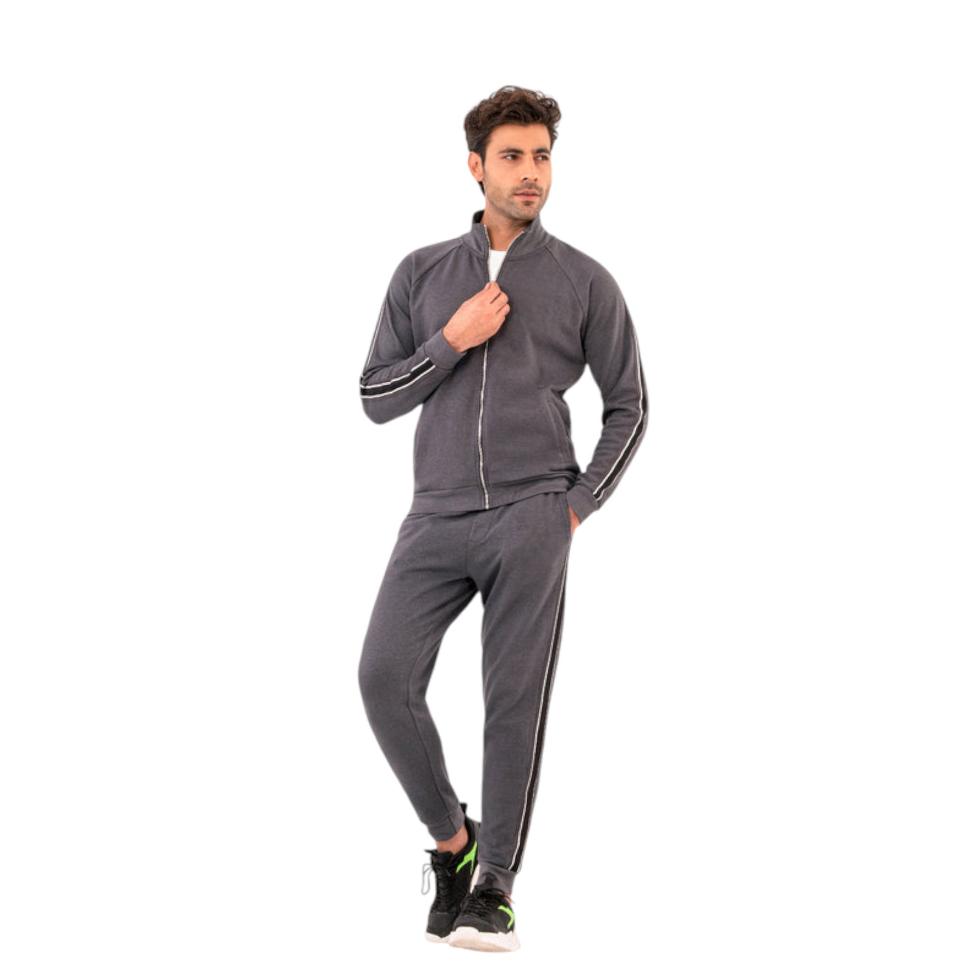 A man wearing a modern grey tracksuit with a zipper jacket and striped joggers. The tracksuit is designed with contrasting stripes for a contemporary look.