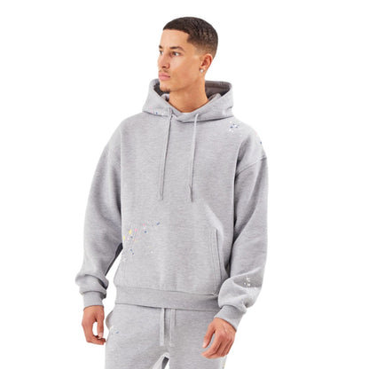 Man wearing a gray tracksuit on a white background
