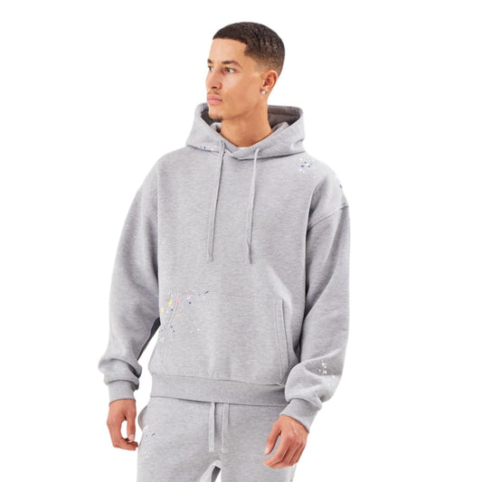 Man wearing a gray tracksuit on a white background