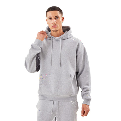 Man wearing a gray hoodie and pants on a white background