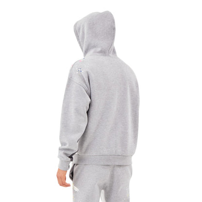 Gray tracksuit worn by a person on a white background