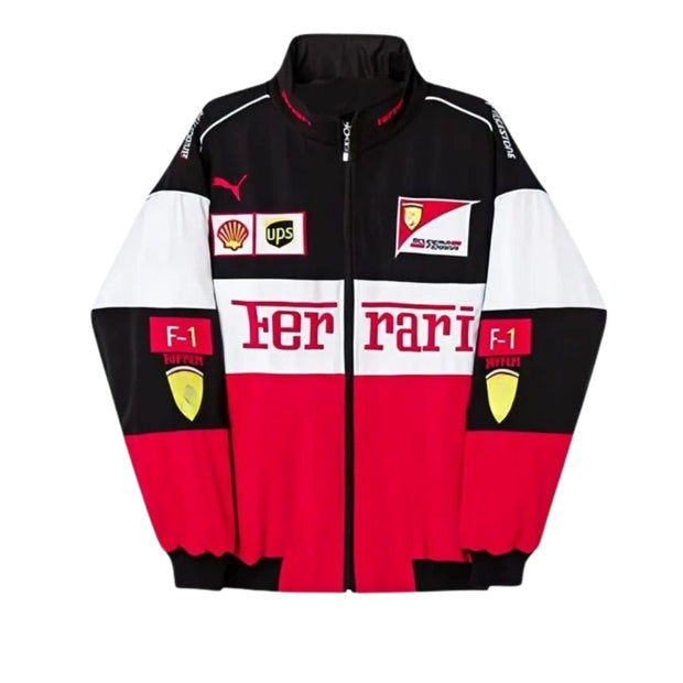 A Ferrari Puma track jacket with a black, white, and red color-blocked design, featuring the 'Ferrari' logo across the chest, Puma and UPS sponsor logos, and Scuderia Ferrari patches.