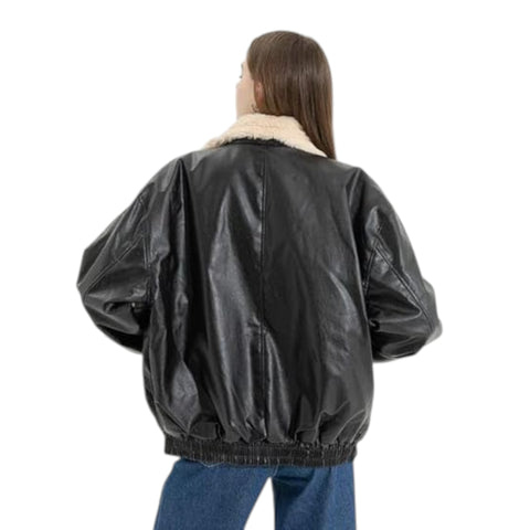 Person wearing a black leather jacket with a white fur collar on a white background