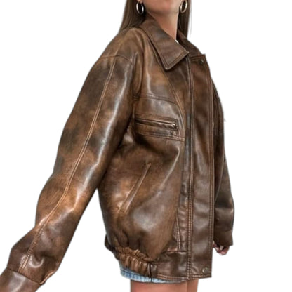 Brown leather jacket worn by a person on a white background