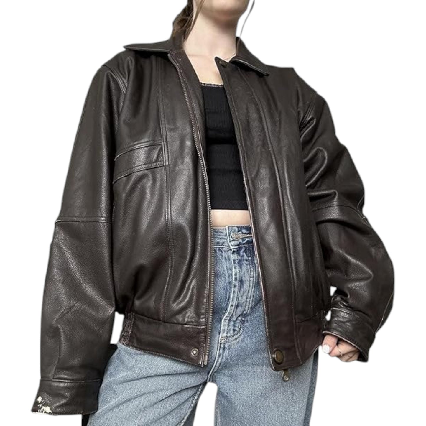 Person wearing a brown leather jacket and blue jeans on a white background