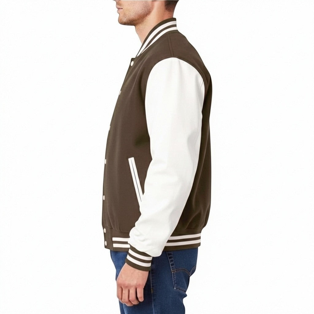 Fit to lead Traders unisex brown varsity jacket with white sleeves, ribbed collar, cuffs, and hem. Snap button closure.