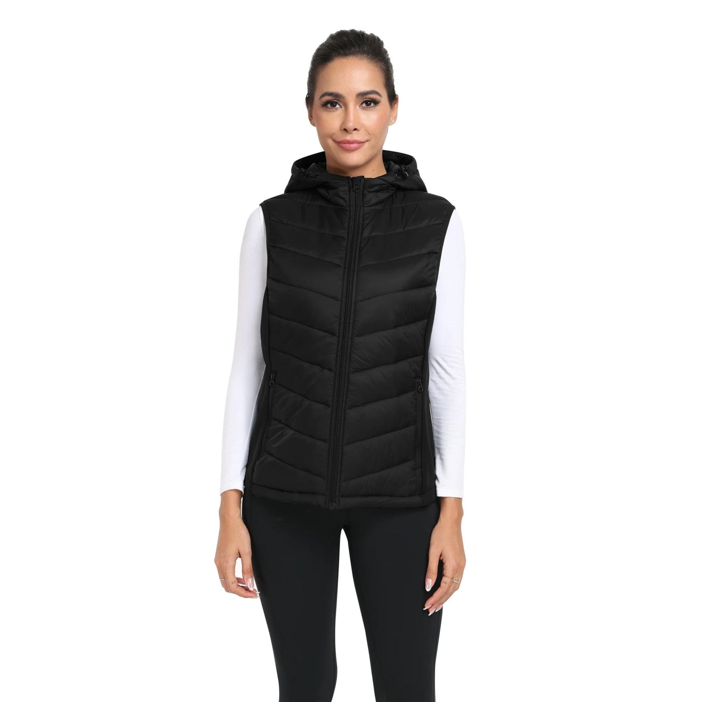 Woman wearing a black puffer vest on a white background
